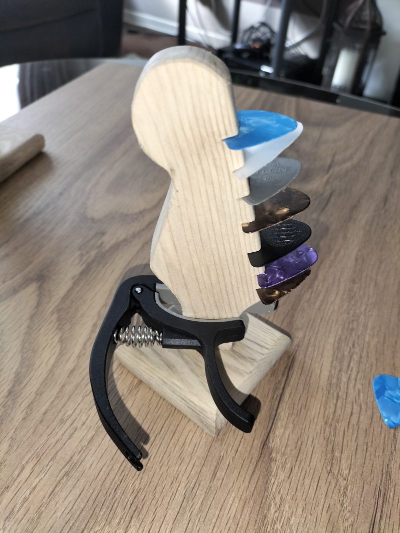 Guitar head stock pick holder