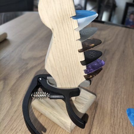 Guitar head stock pick holder