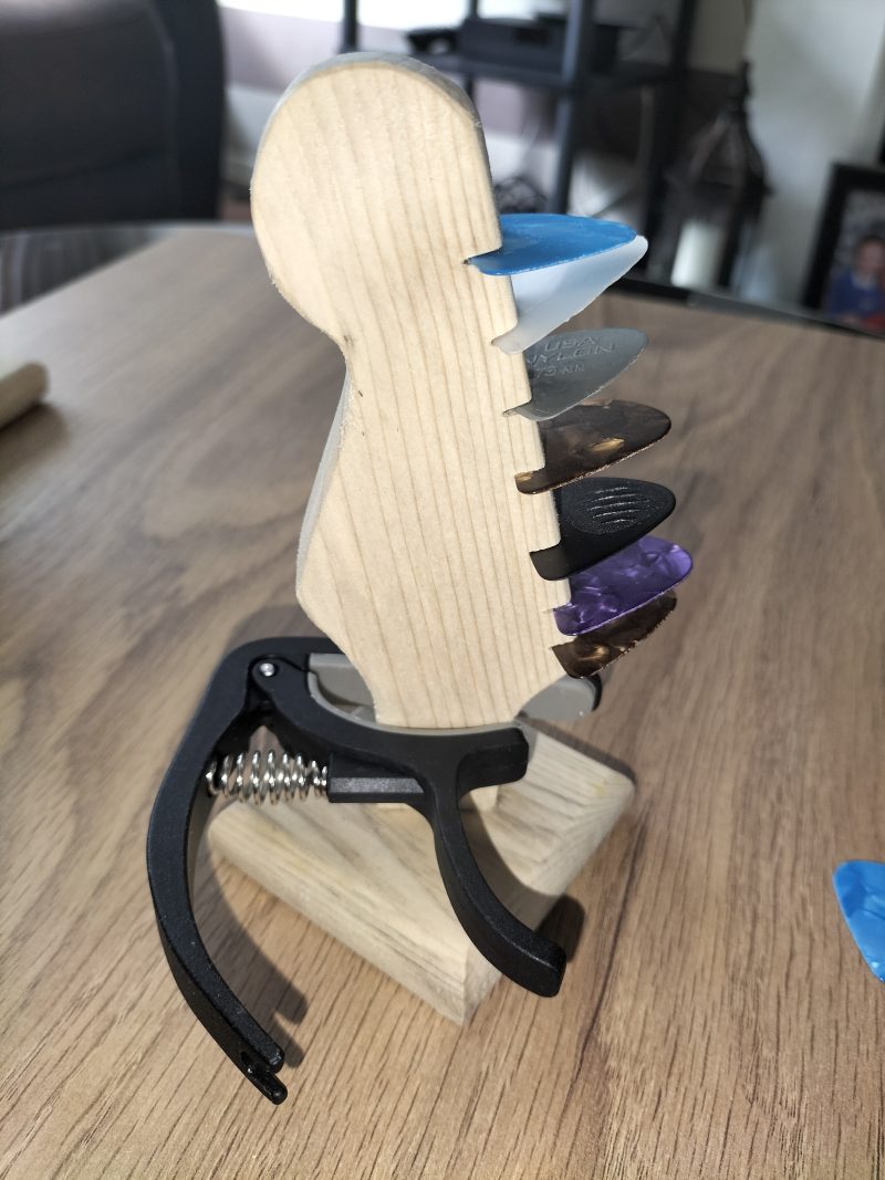 Guitar head stock pick holder