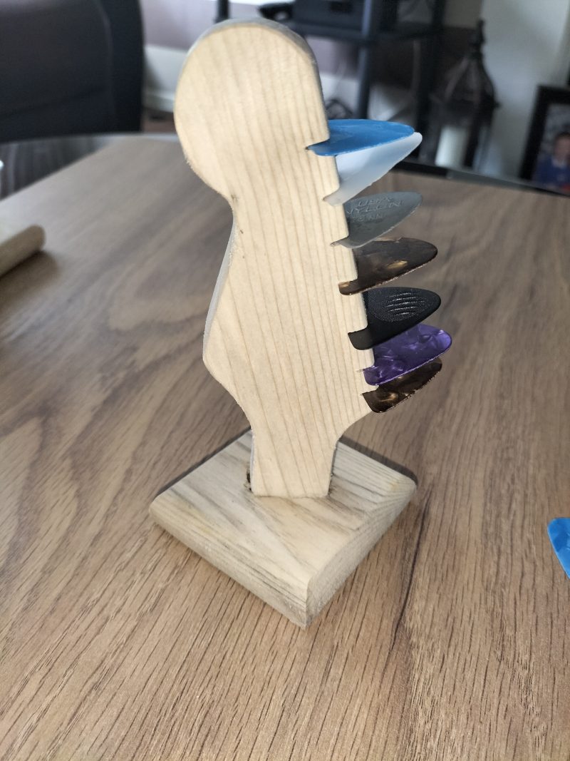 Guitar head stock pick holder
