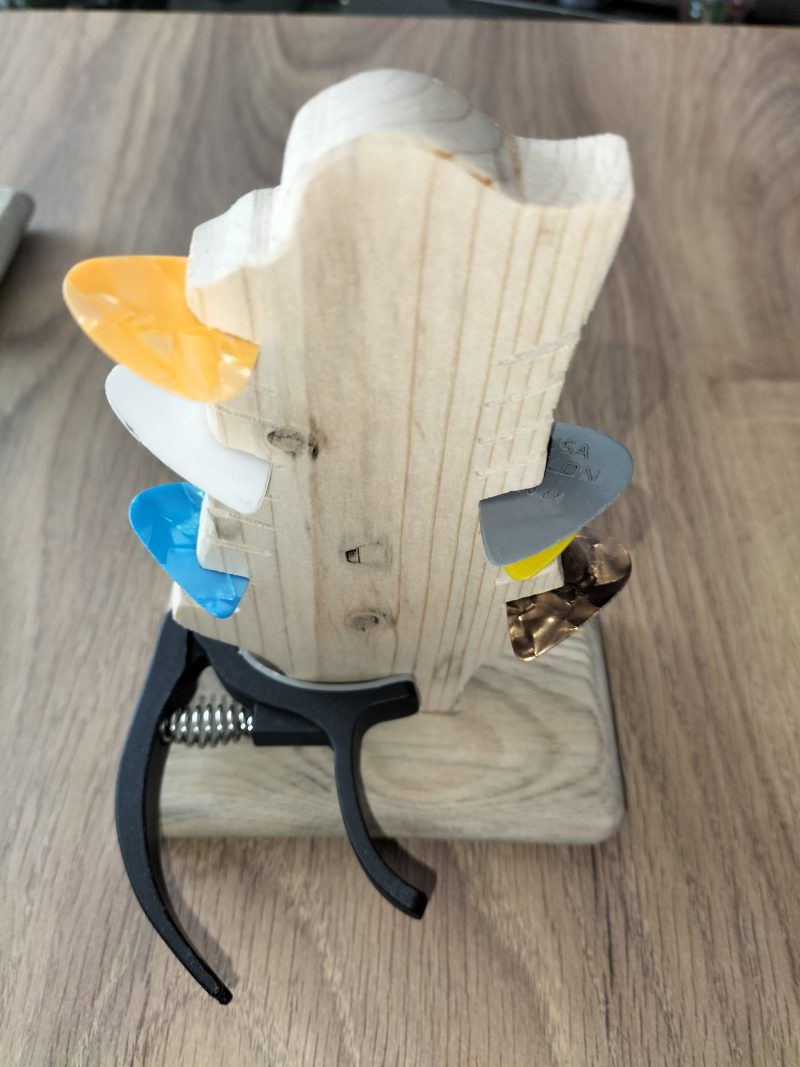 Guitar head stock pick holder