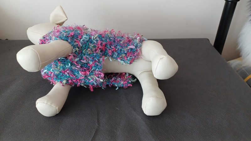 Hand Knitted Small Dog Coat Jade Green With Pinks And Blue Ribbon Tufts