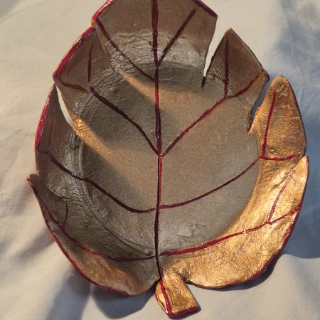 Handmade clay leaf dish gold and red glazed for finish and quality.
