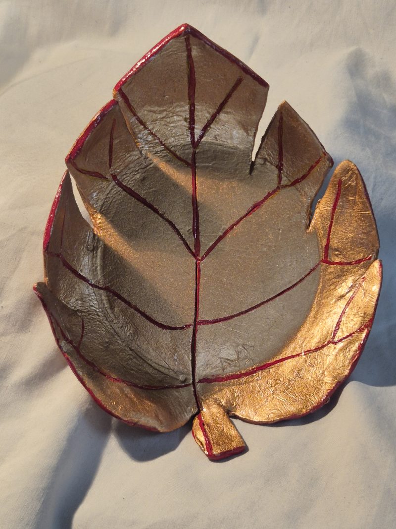 Handmade clay leaf dish gold and red glazed for finish and quality.