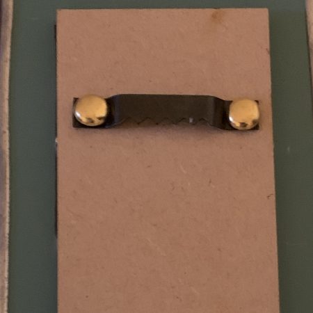 Stained glass effect mirrors with green and orange flowers.