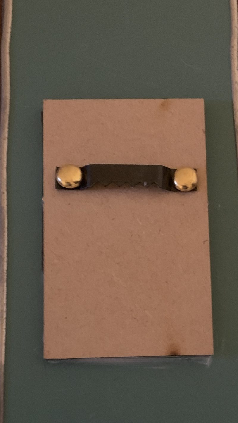 Stained glass effect mirrors with green and orange flowers.