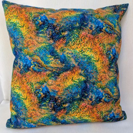 Reverse of Elemental Earth goddess cushion cover detailing the orange, blues, yellows and greens from the front cover