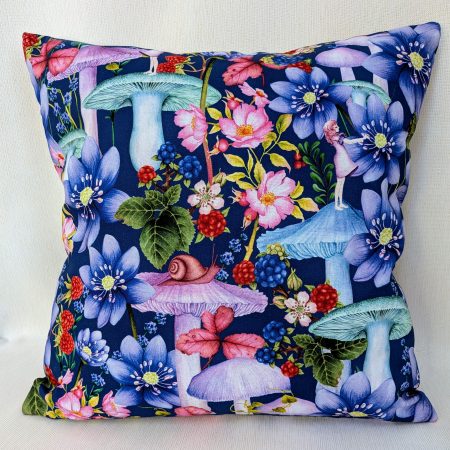 Decorative 18" 45cm pillow cover with whimsical girl, mushrooms, berries and large flowers on a navy blue botanical background.
