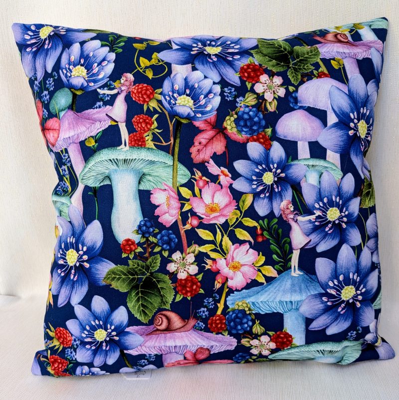 Reverse of the decorative 18" 45cm pillow cover with whimsical girl, mushroom, berries and large flowers on a navy blue botanical background.