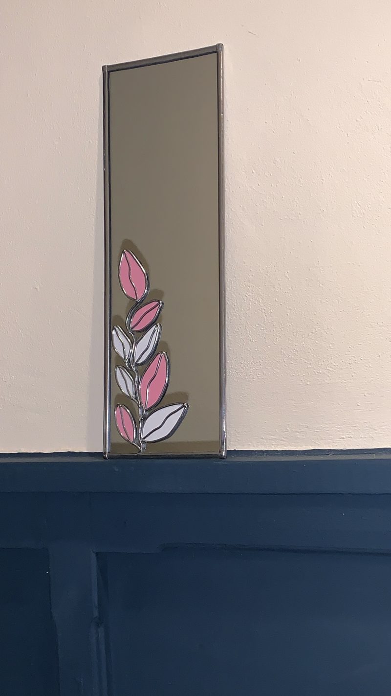 Stained glass effect Mirror with Art nouveau style pink and white leaf pattern.