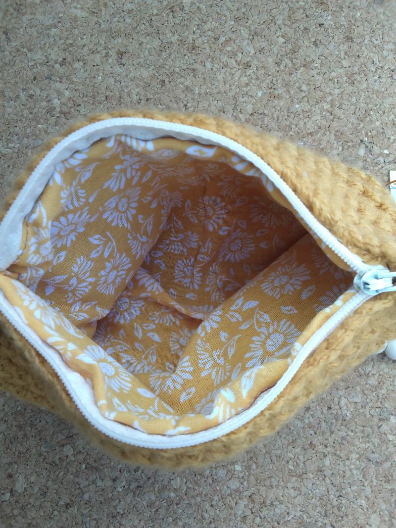 Handmade crochet purse, fully lined with zip fastening. Mustard main colour with flower cotton lining