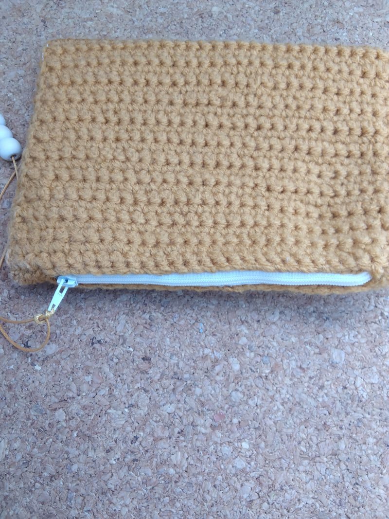 Handmade crochet purse, fully lined with zip fastening. Mustard main colour with flower cotton lining