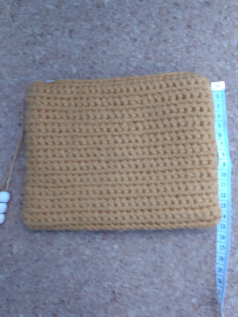 Handmade crochet purse, fully lined with zip fastening. Mustard main colour with flower cotton lining
