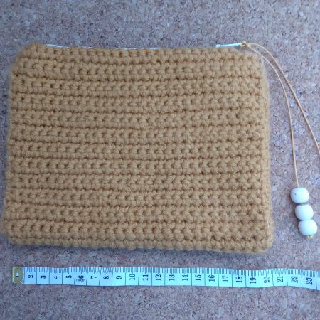 Handmade crochet purse, fully lined with zip fastening. Mustard main colour with flower cotton lining