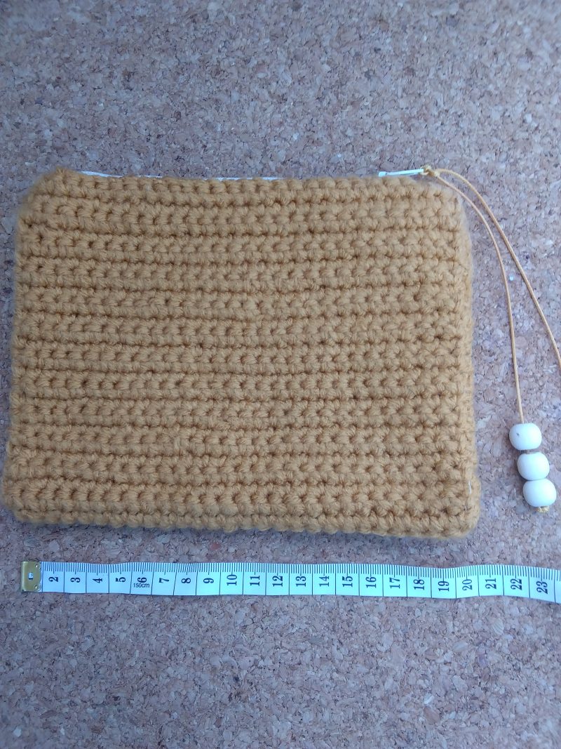 Handmade crochet purse, fully lined with zip fastening. Mustard main colour with flower cotton lining