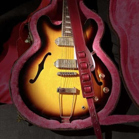 Handmade leather guitar straps available in black, blue and burgundy.