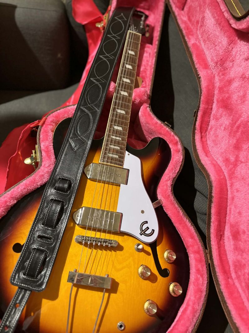 Handmade leather guitar straps available in black, blue and burgundy.