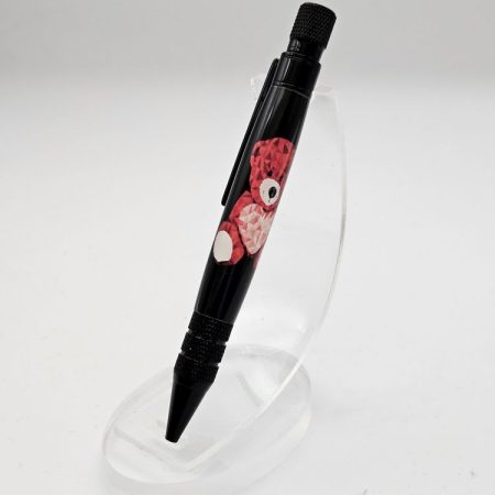 A hand crafted Headwind Twist Pen in Black Chrome and Teddy Design