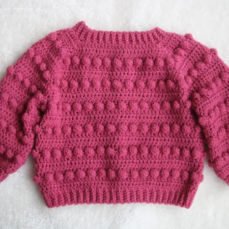 Back View of Crochet Bobble Cardigan in Raspberry Pink