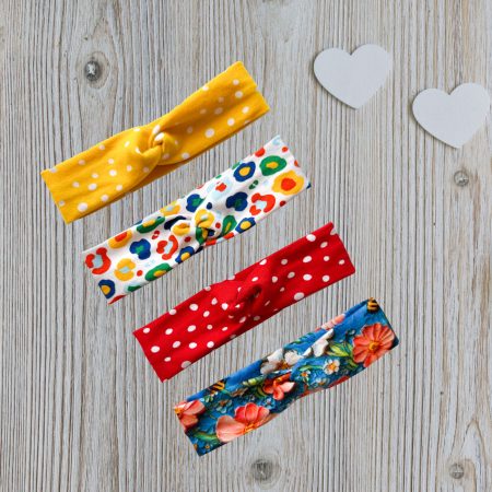 Babies Headband on Red Fabric with White Spots
