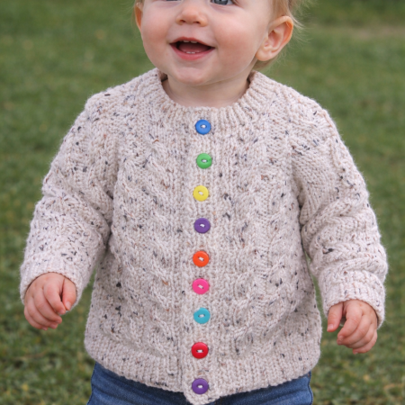 Cabled cardigan in soft yarn giving a tweed look.