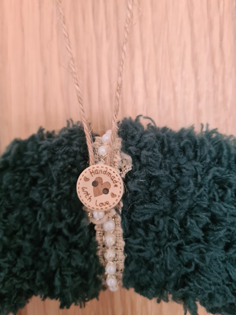 Dark green yarn wrapped wreath