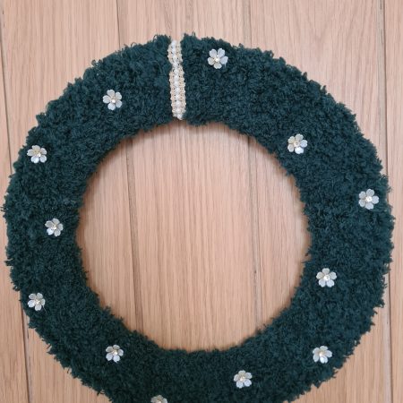Dark green yarn wrapped wreath