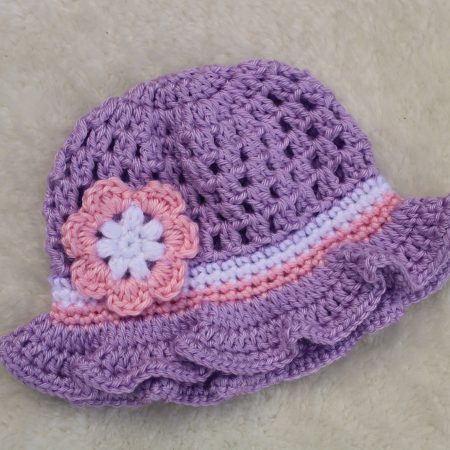 Crochet Lilac Summer Hat for a Baby Girl with a Ruffle Brim and Flower Decoration