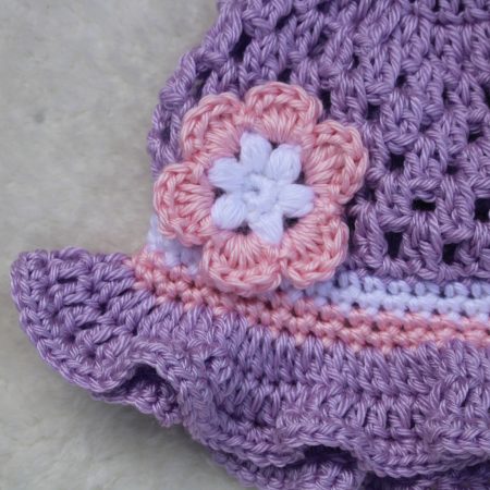 Crochet Flower Decoration on a Sun Hat for a Baby Girl