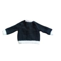 Long sleeved black cardigan with white trim. A lovely lace trim up the front and around the neck can be added. Comes is various sizes. Acrylic yarn for easy care.