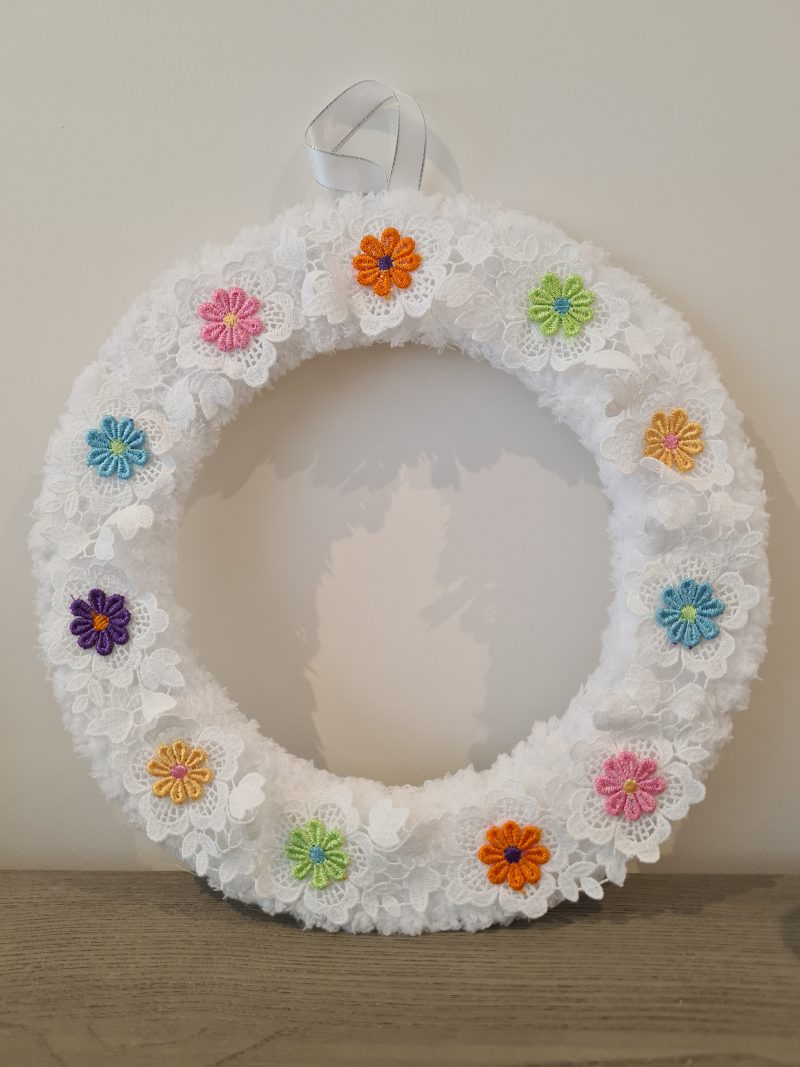 Fluffy white yarn wrapped wreath