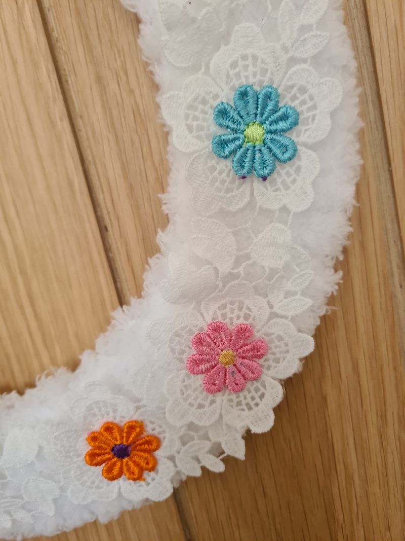 Fluffy white yarn wrapped wreath