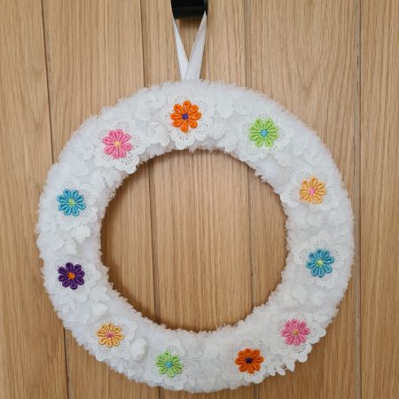 Fluffy white yarn wrapped wreath
