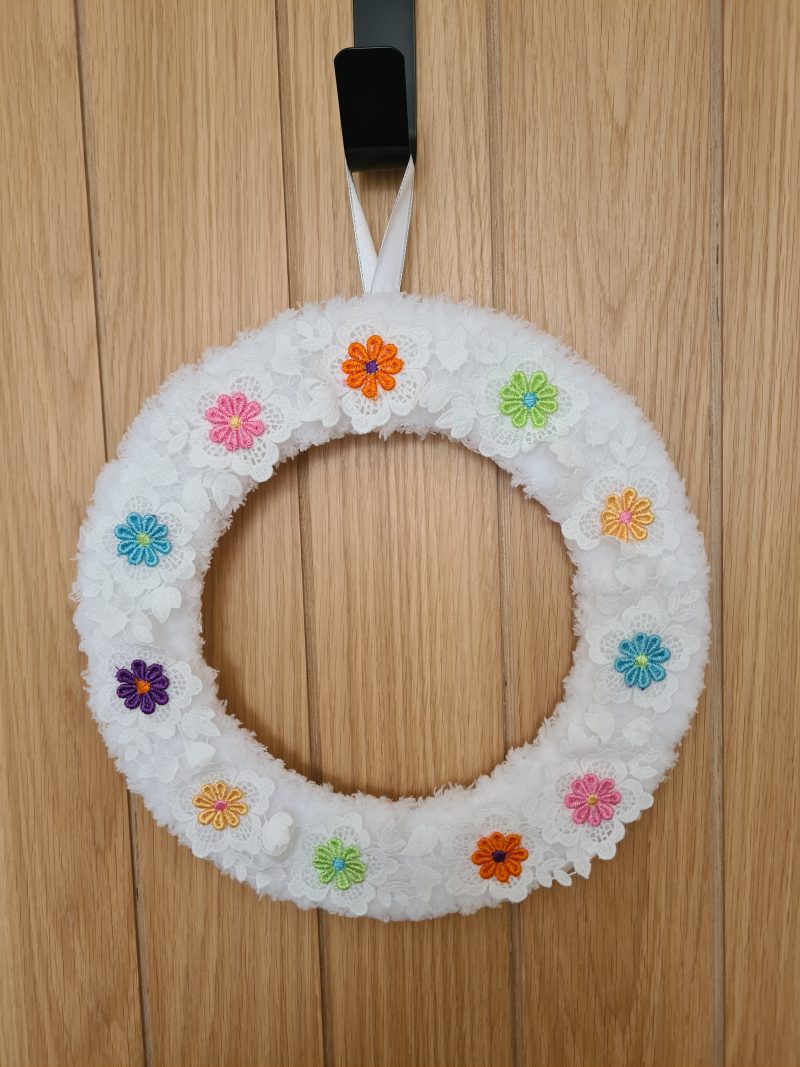 Fluffy white yarn wrapped wreath