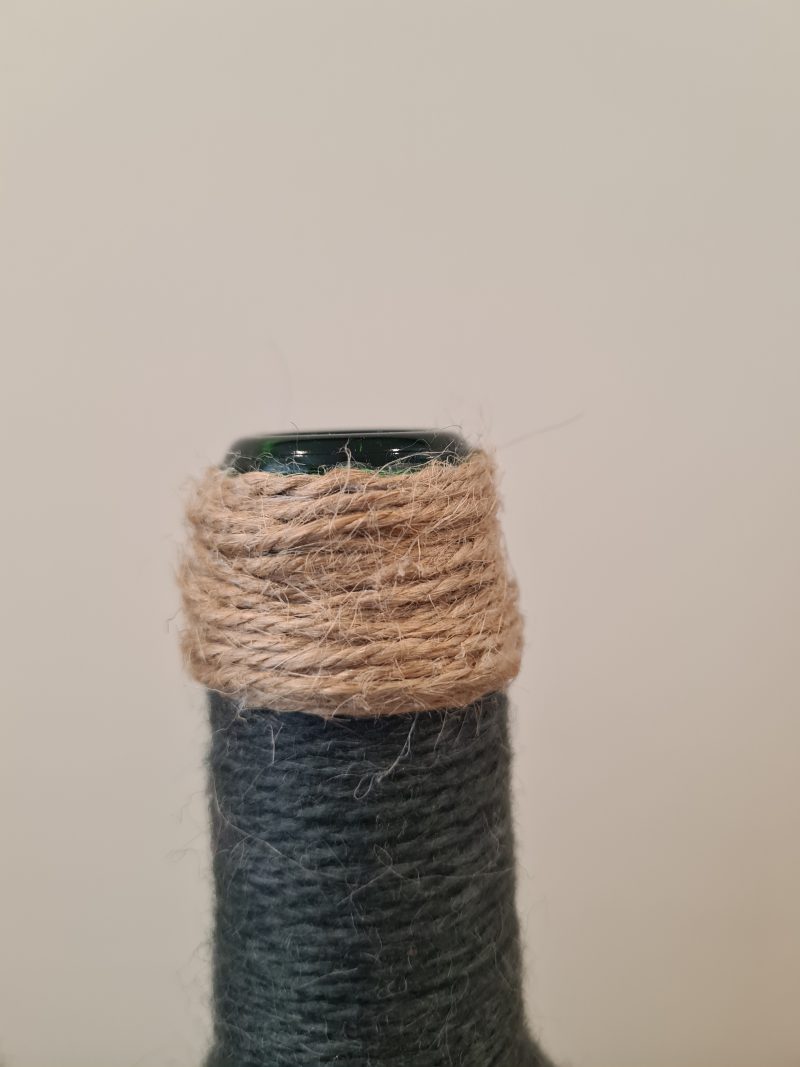 Dark grey yarn wrapped bottles