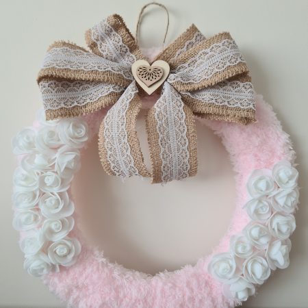 Delicate pink yarn wrapped wreath