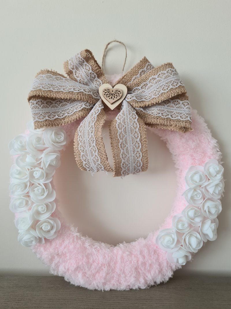 Delicate pink yarn wrapped wreath