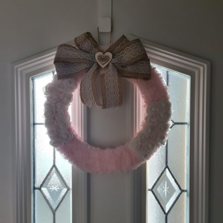 Delicate pink yarn wrapped wreath