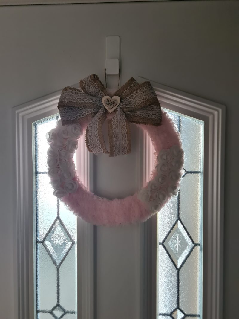 Delicate pink yarn wrapped wreath