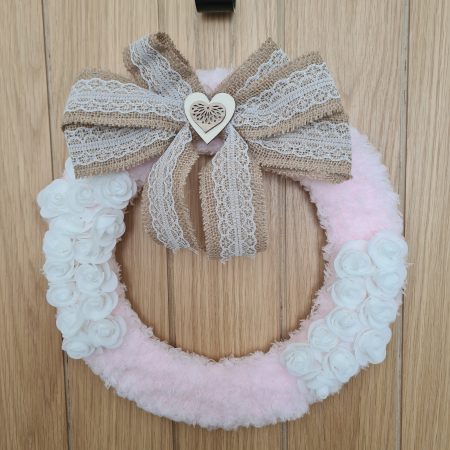 Delicate pink yarn wrapped wreath
