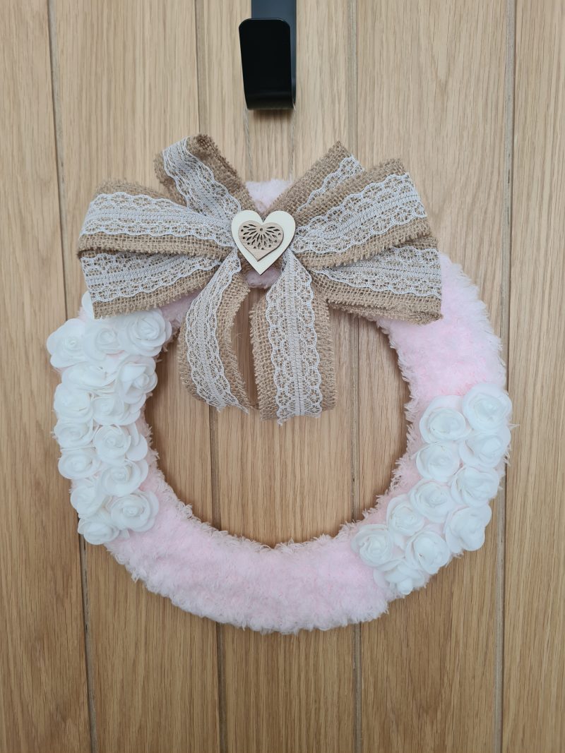 Delicate pink yarn wrapped wreath