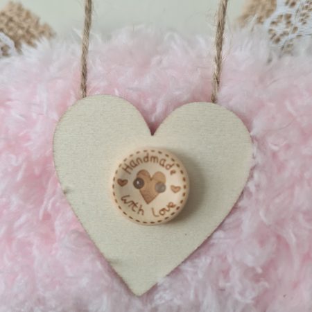 Delicate pink yarn wrapped wreath