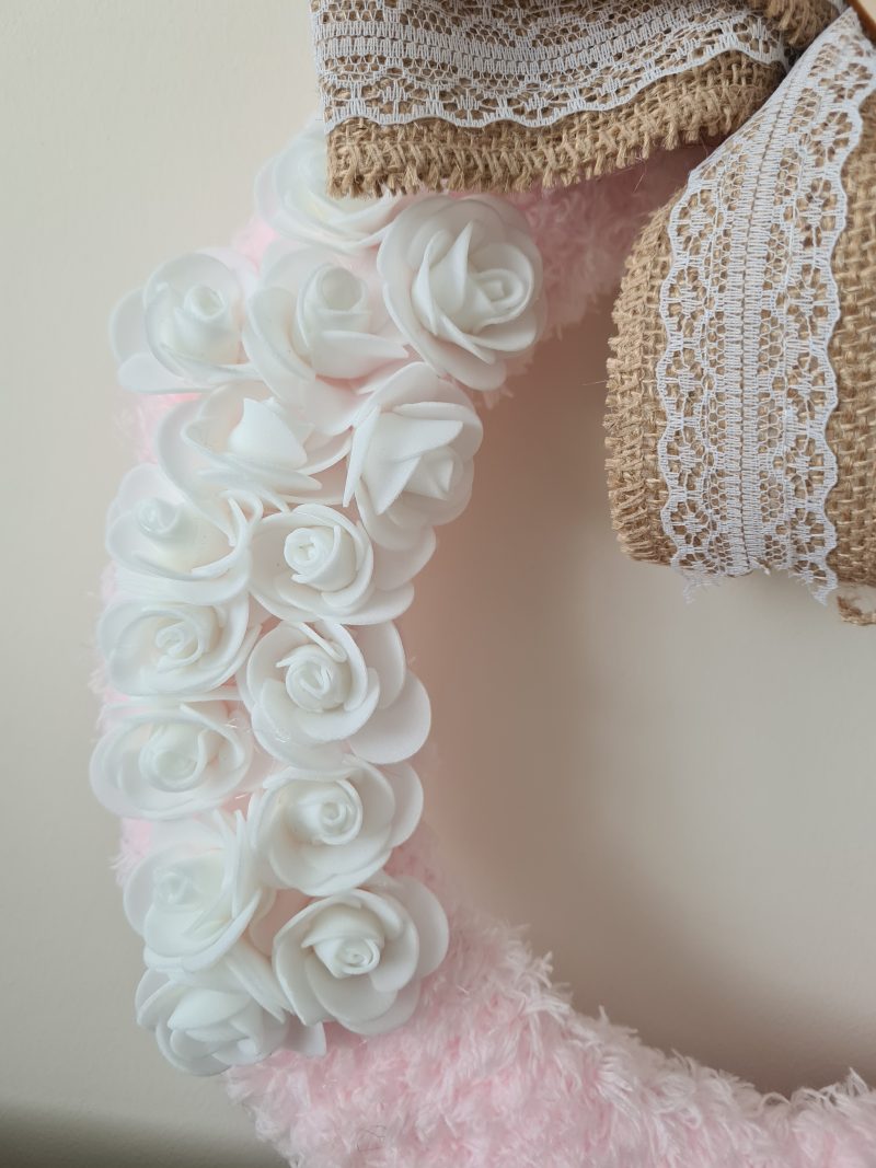 Delicate pink yarn wrapped wreath