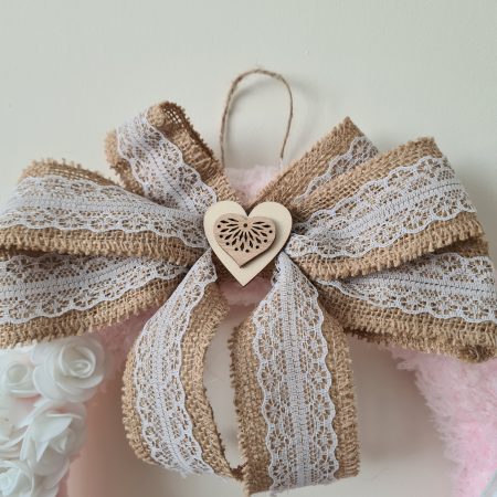 Delicate pink yarn wrapped wreath