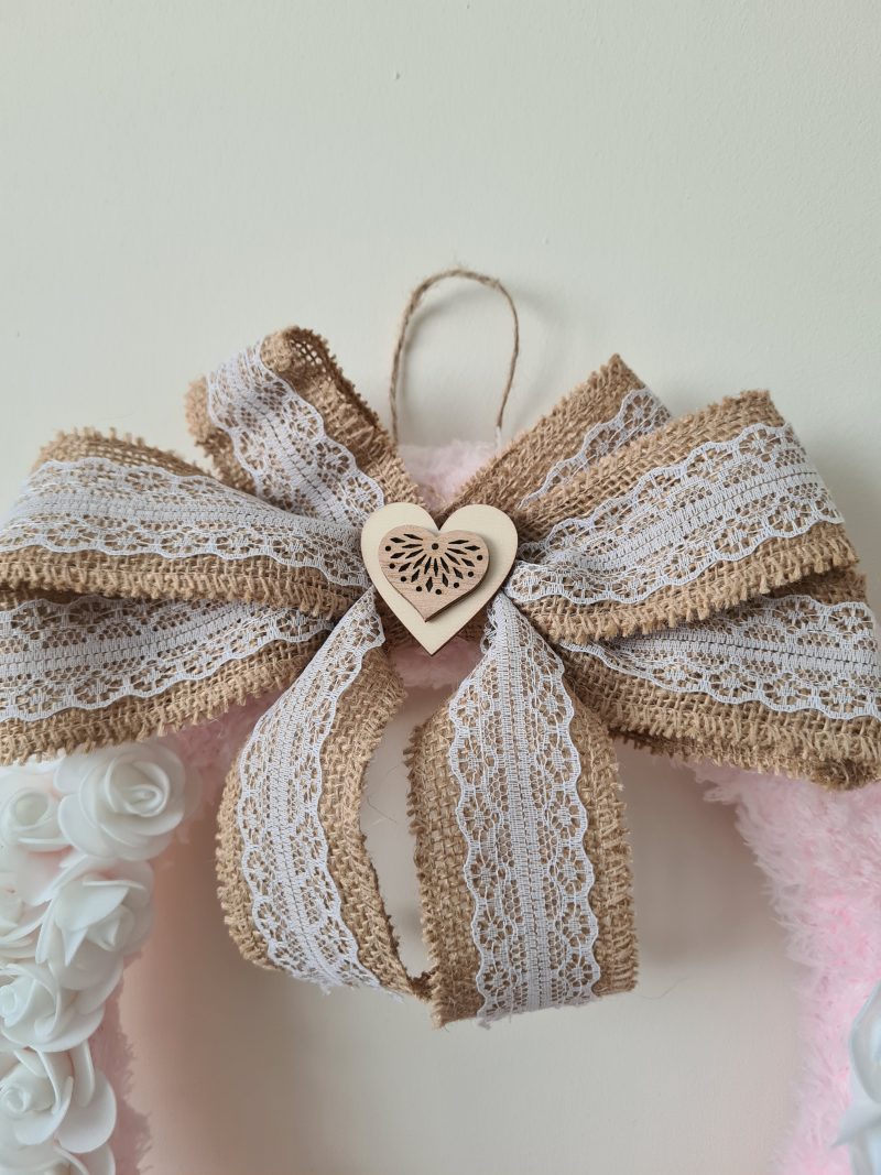 Delicate pink yarn wrapped wreath