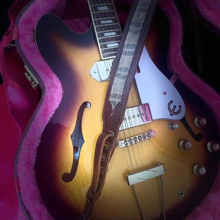 Handmade leather guitar straps available in black, blue and burgundy.