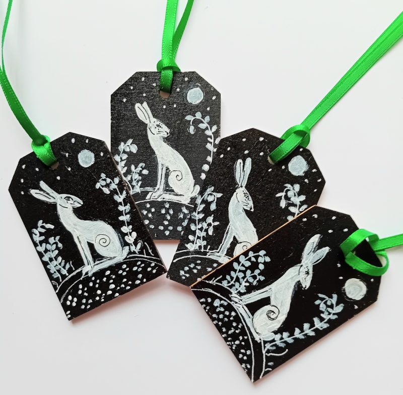 hand painted special set of 4 gift tags white hares on black background in moonlight green ribbons