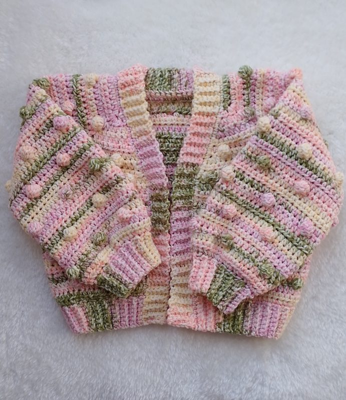 Crochet Cardigan in Spring Colours for Girls. Available in sizes New Baby through to Child 3-4 years