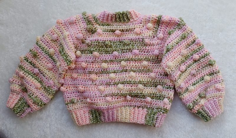 Crochet Cardigan in Spring Colours for Girls. Available in sizes New Baby through to Child 3-4 years