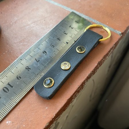 Green and white crystal and leather keyring